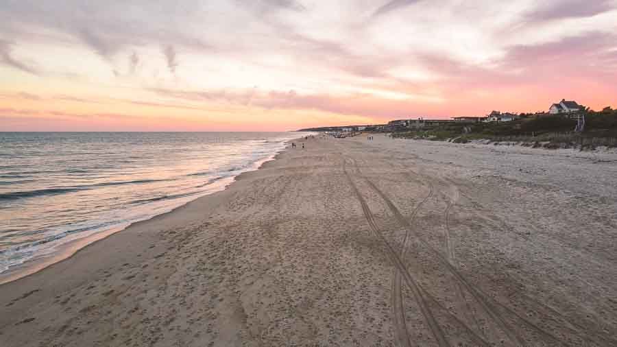 montauk town beach at sunset in the summer