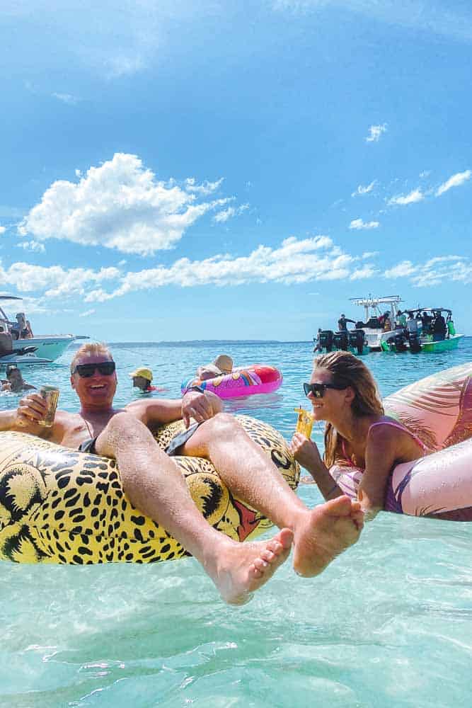 man and woman having fun on innertubes at playa crash boat puerto rico